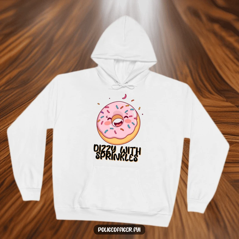 Funny hoodie illustrates a joyful donut with abundant sprinkles spinning energetically, offering a warm embrace of sweet humor.