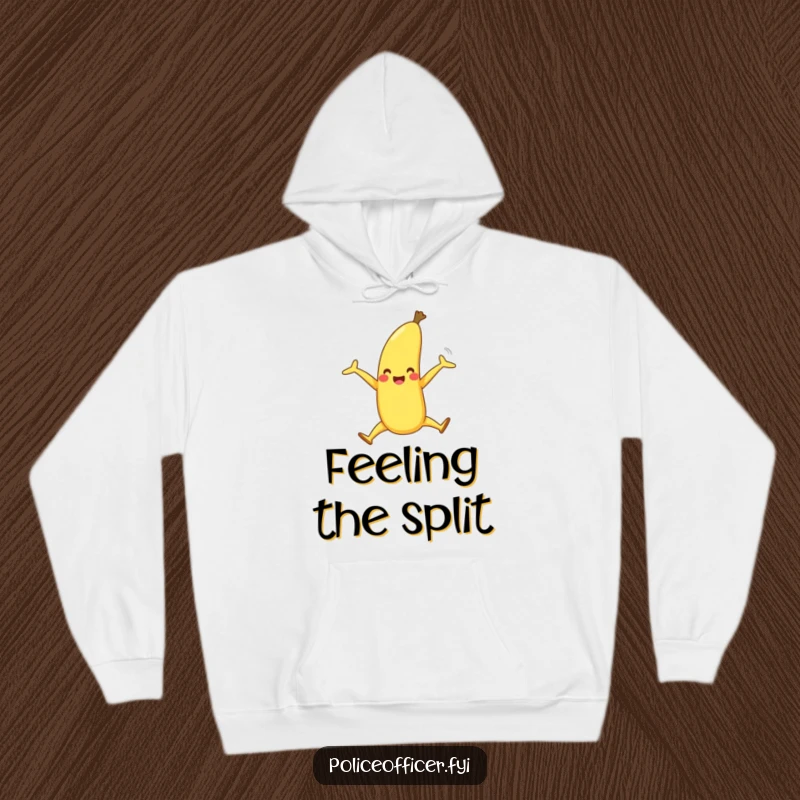 Funny hoodie illustrates a happy banana with legs in a jubilant split, offering warm comfort and sweet, playful humor.
